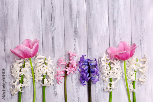 Fototapeta Naklejka Na Ścianę i Meble -  Beautiful flowers on color wooden background