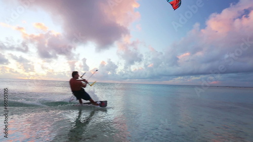 kite surfing at sunset. fun in the ocean, extreme sport