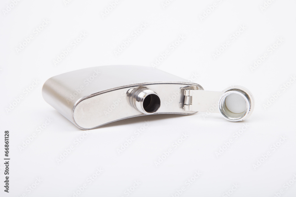 Silver metal hip flask on a white background. Silver metal hip flask on a white background.