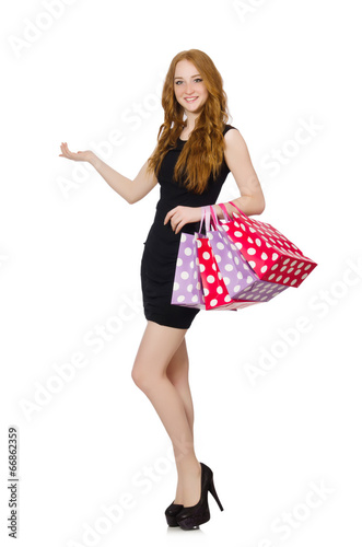 Woman with shopping bags isolated on white © Elnur