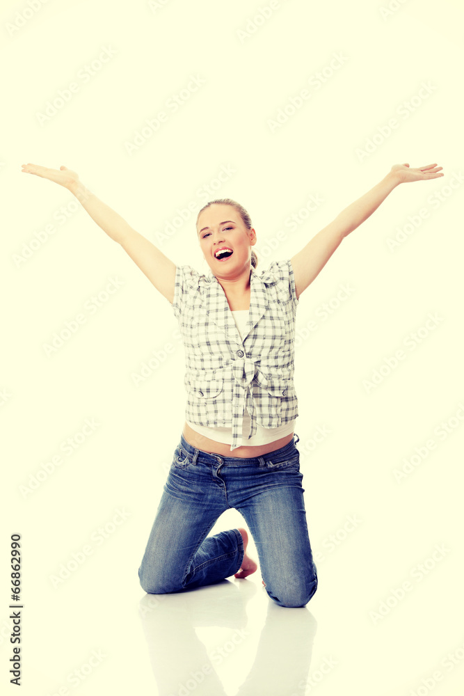 Young happy woman with hands up Young happy woman with hands up