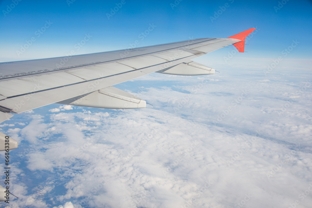 Airplane wing out of window Airplane wing out of window