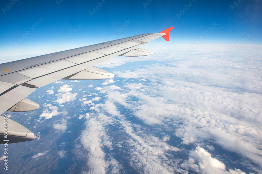 Airplane wing out of window Airplane wing out of window