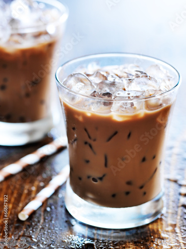 two glasses of iced coffee shot with selective foc us