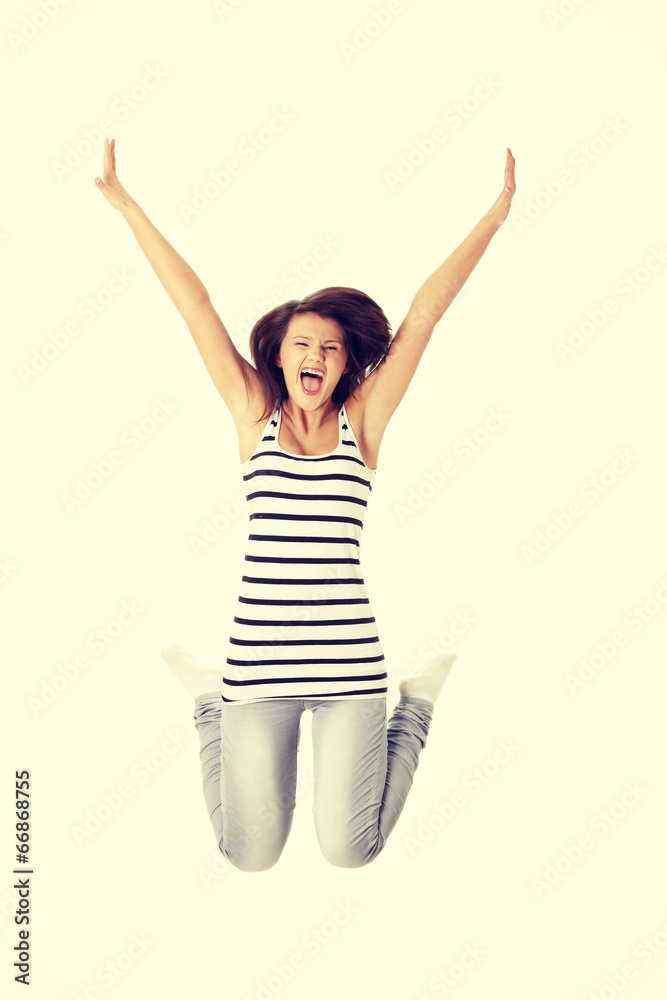 Young happy caucasian woman jumping in the air Young happy caucasian woman jumping in the air