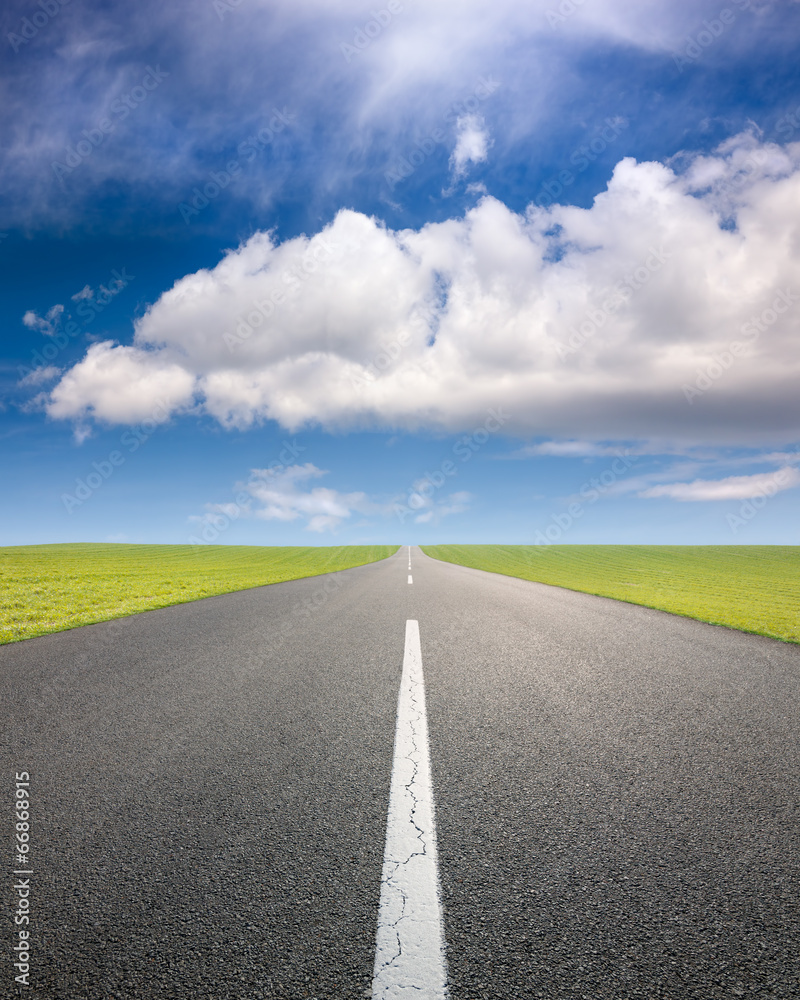 Driving on an empty road through the fields Driving on an empty road through the fields
