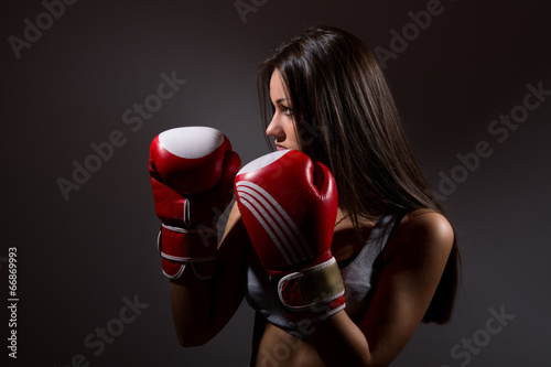 Beautiful woman with the boxing gloves