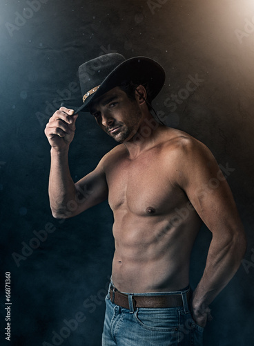 Sexy cowboy with smoky background