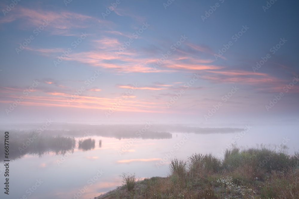 Fototapeta premium misty sunrise over river
