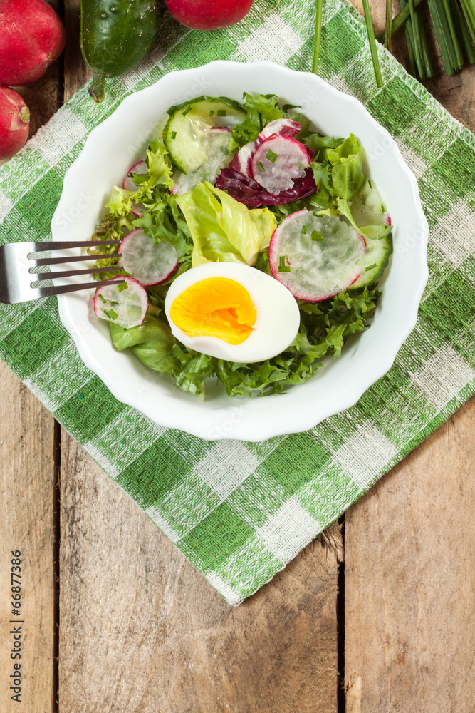 Salad with egg, radish and cucumber.