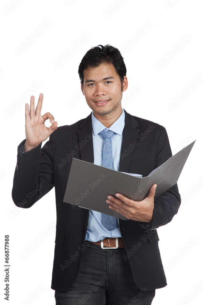 Asian businessman show OK sign with a folder Asian businessman show OK sign with a folder