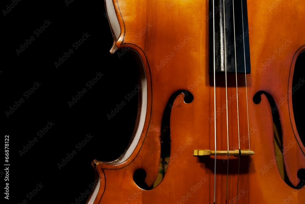 Fototapeta Cello orchestra musical instruments closeup on black