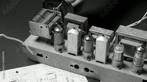 ancient superheterodyne type radio with tubes photo