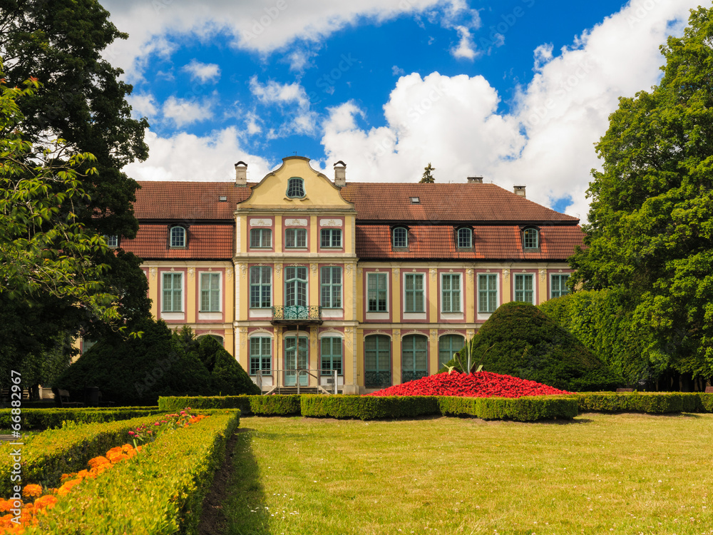 Fototapeta premium view on abbots palace and flowers in gdansk oliva park.