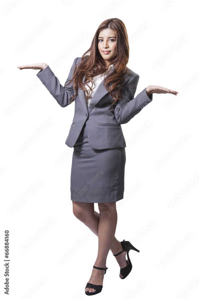 attractive businesswoman presenting something on the palm of her attractive businesswoman presenting something on the palm of her