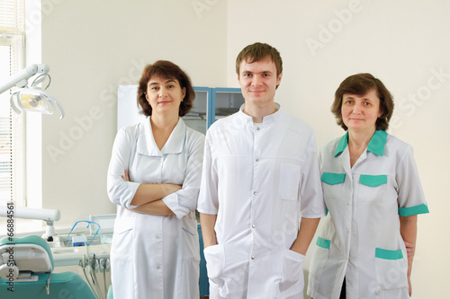 medical doctors standing in dentist office