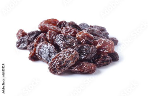 pile of raisins on white background