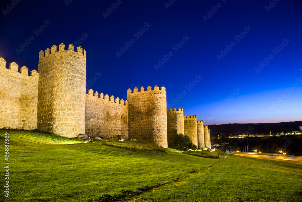 Scenic medieval city walls of Avila at night, Spain, UNESCO list