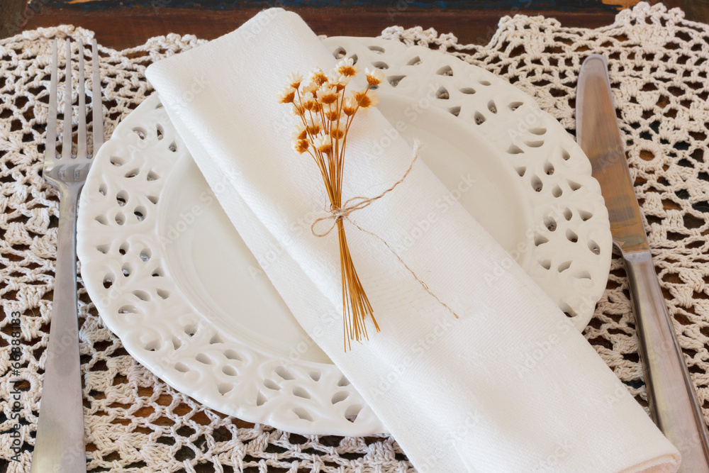 White plate serviette fork knife dried flowers crochet Stock Photo | Adobe  Stock