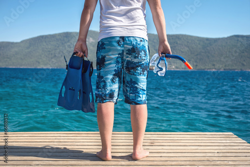 man with fins and mask