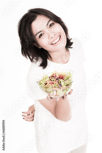 portrait of a lovely young woman eating healthy