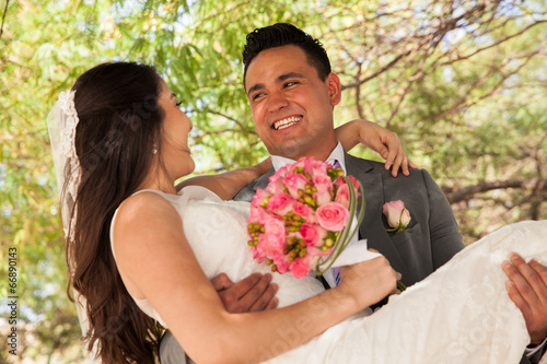 Carrying bride and having fun