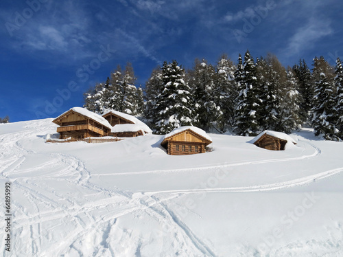 chalets and mountain houses in the middle of the snow high in th