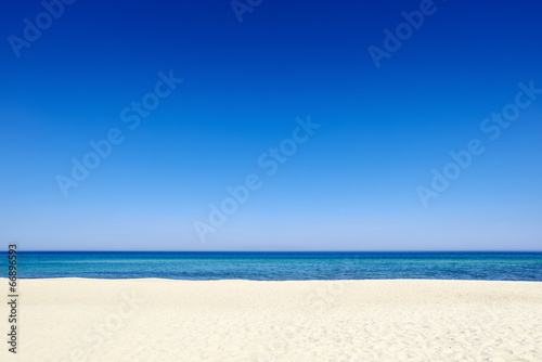 Summer blue sky sea coast sand background copyspace. © boguslaw