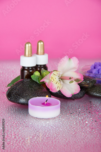 Set of fragrant oils  salt  candles and flower