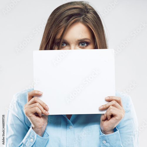 Business woman hiding face behind banner.