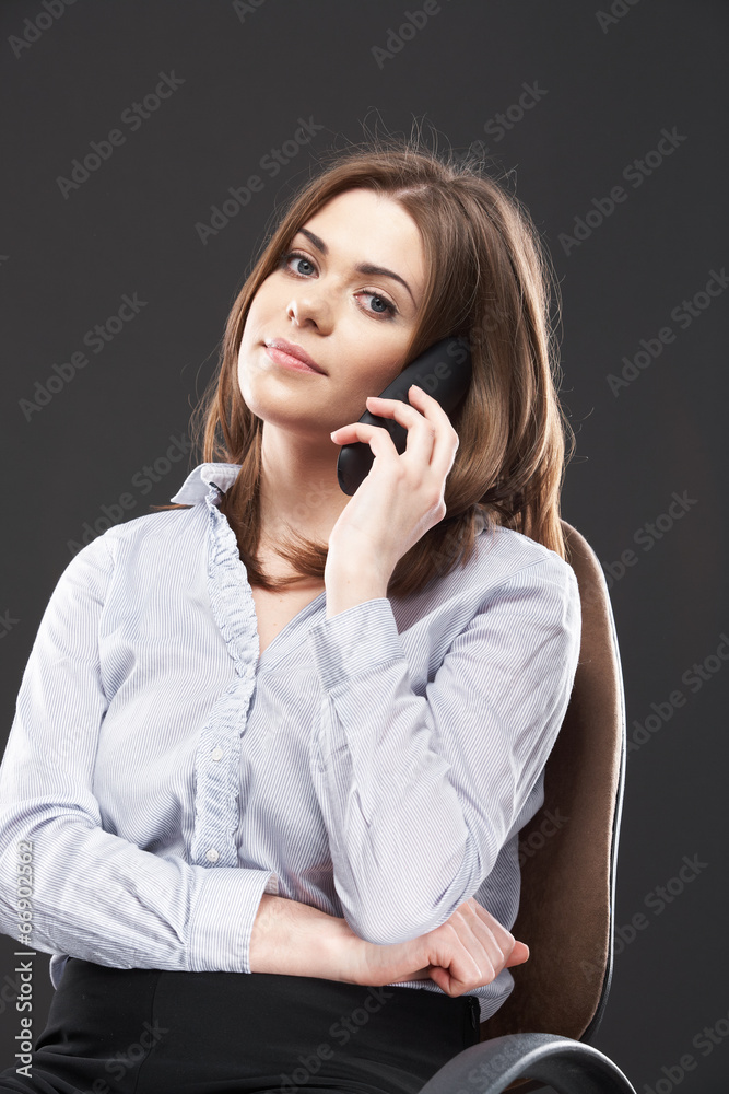 Beautiful business woman sitting in chair Beautiful business woman sitting in chair
