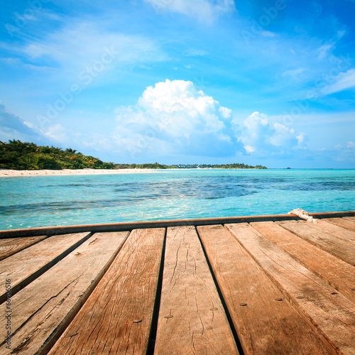 Jetty, beach and jungle - vacation background © fotomaximum