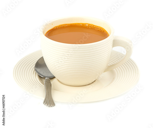 Cup of hot milk tea on white
