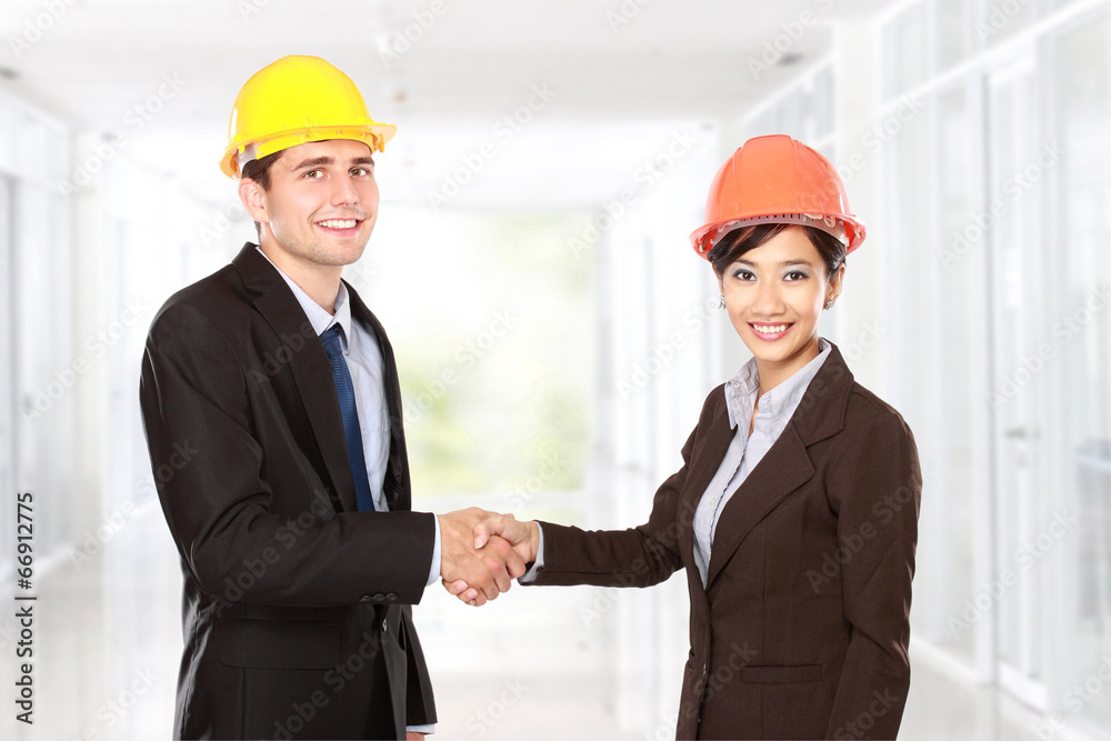 shaking hands at construction site shaking hands at construction site