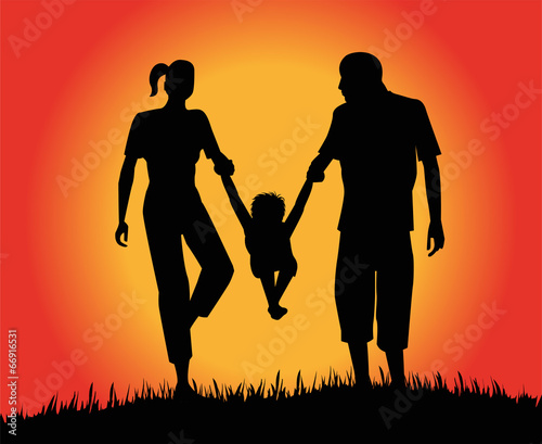 silhouette di famiglia in un prato