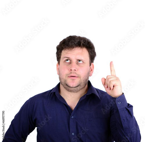 Portrait of young businessman looking up with arms spread with g