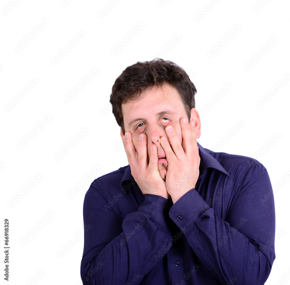 Portrait of young desperate businessman pulling his face down i Portrait of young desperate businessman pulling his face down i