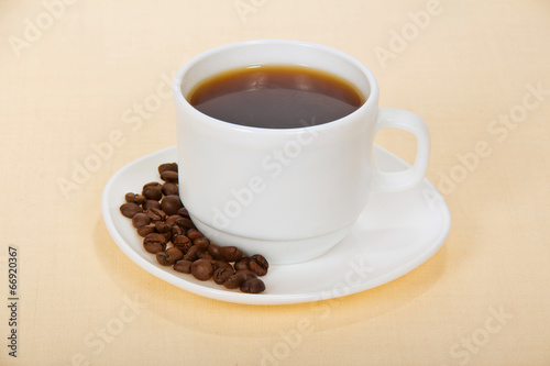 Fototapeta Naklejka Na Ścianę i Meble -  White cup of coffee with grains