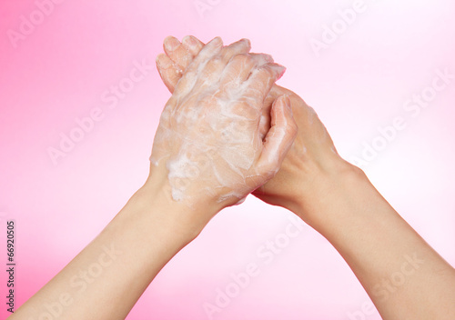 Woman s hands in soapsuds