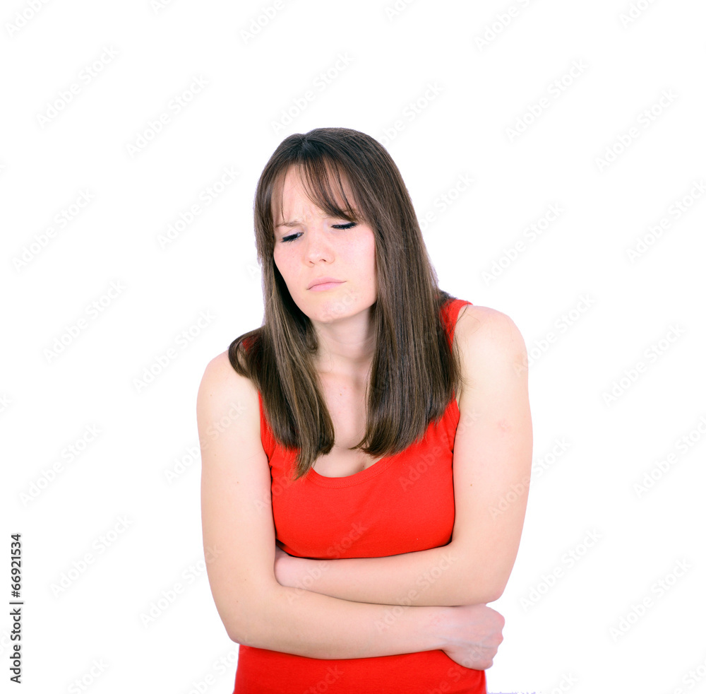 Young woman with stomach pains in studio with white background Young woman with stomach pains in studio with white background