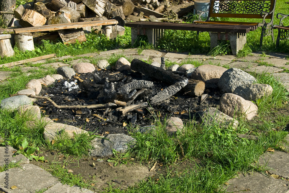 Summer in the open air, fireplace surrounded by stone . Summer in the open air, fireplace surrounded by stone .