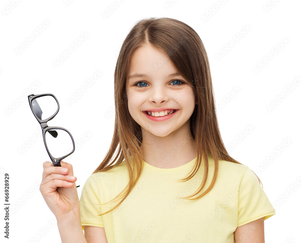 smiling cute little girl holding black eyeglasses smiling cute little girl holding black eyeglasses