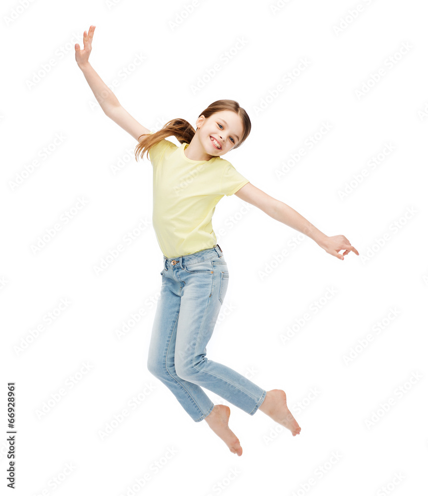 smiling little girl jumping