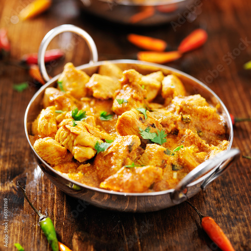 indian chicken curry in balti dish photo