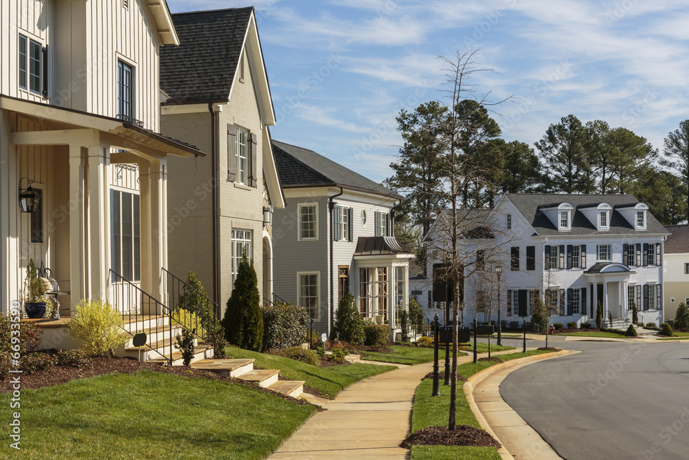 Row Of Upscale Houses On A Curved Neighborhood Street Stock Photo 