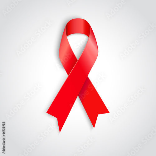 AIDS awareness red ribbon on white background.