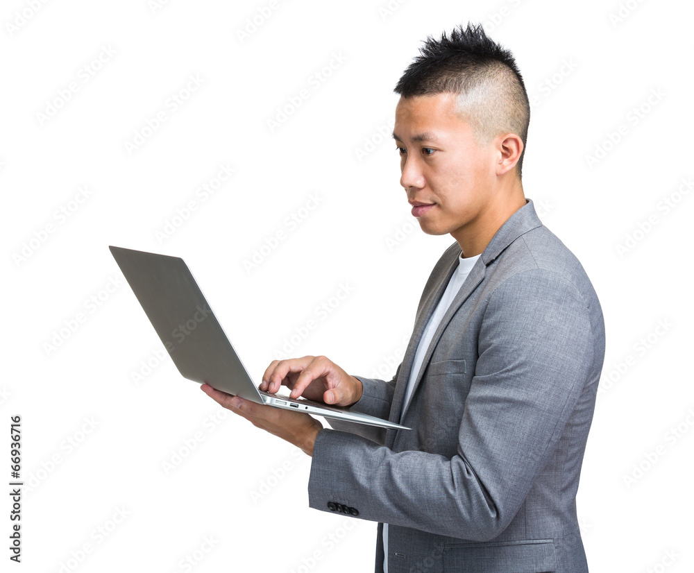 Side profile of business man use laptop computer Side profile of business man use laptop computer