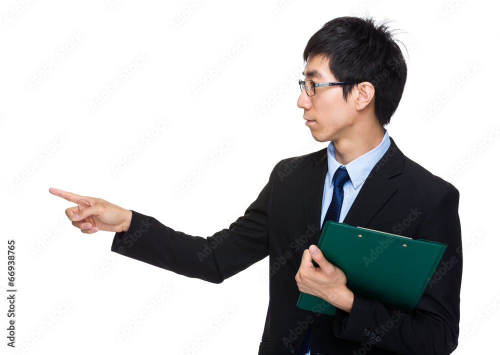 Businessman with clipboard with finger point aside Businessman with clipboard with finger point aside
