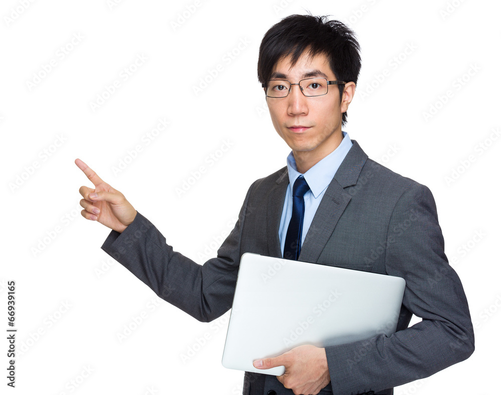 Businessman with laptop computer and finger point out Businessman with laptop computer and finger point out