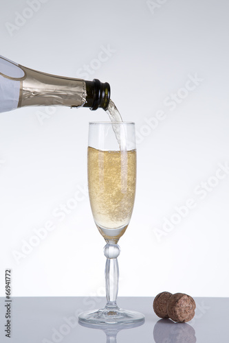 Champagne pouring into an elegant glass